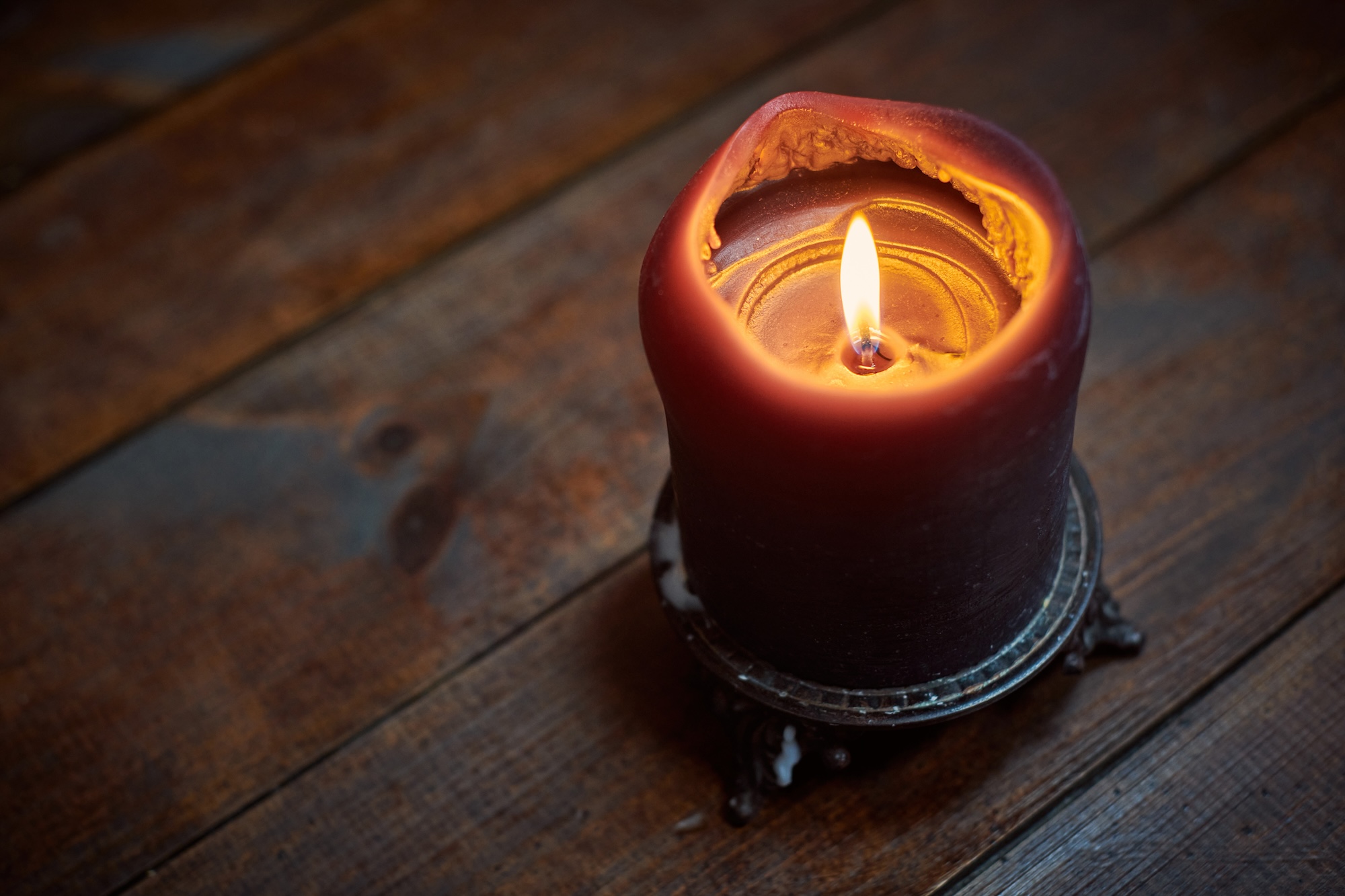 Candle on wooden table