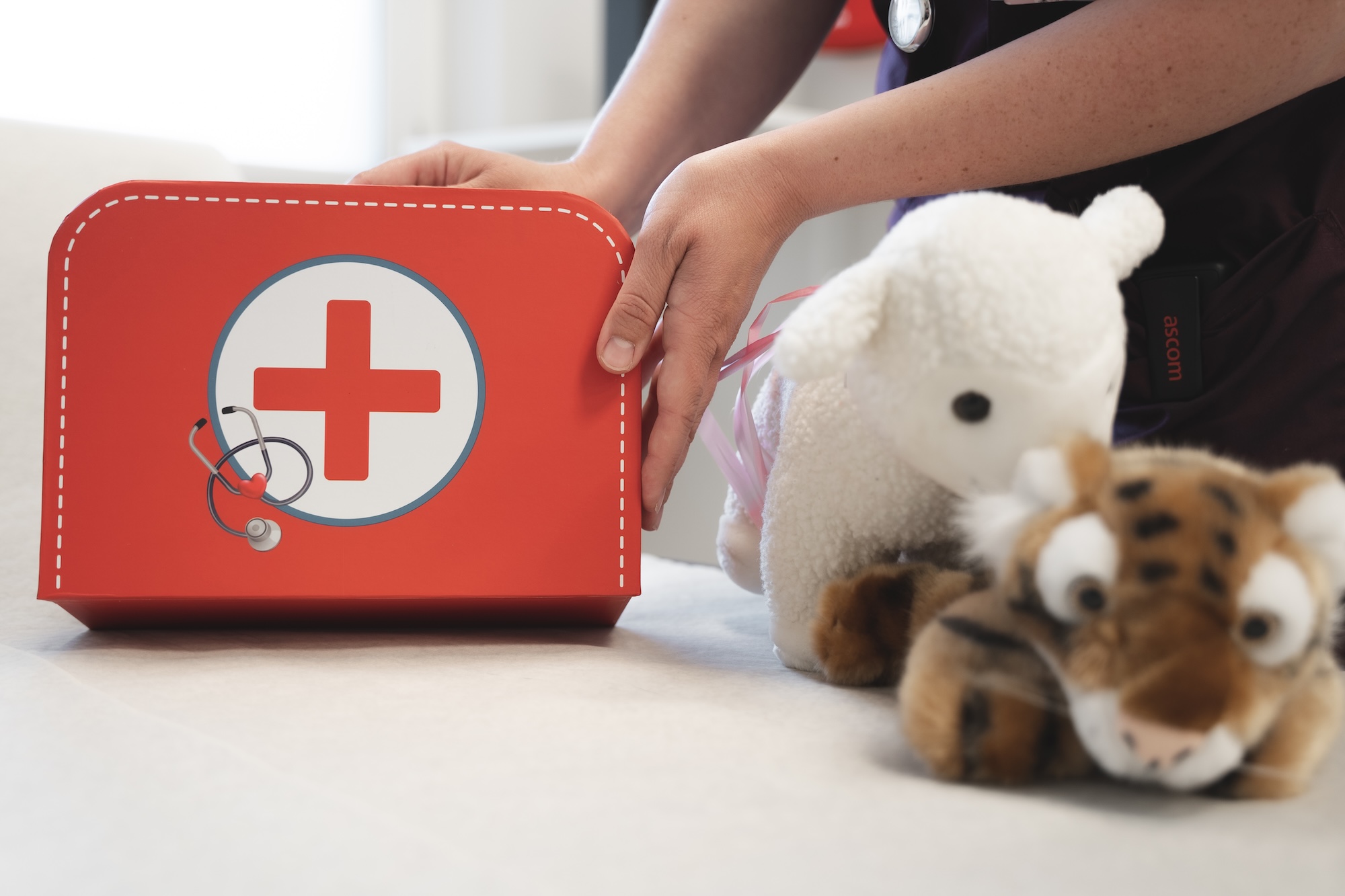 Child's first aid kit and stuffed animals