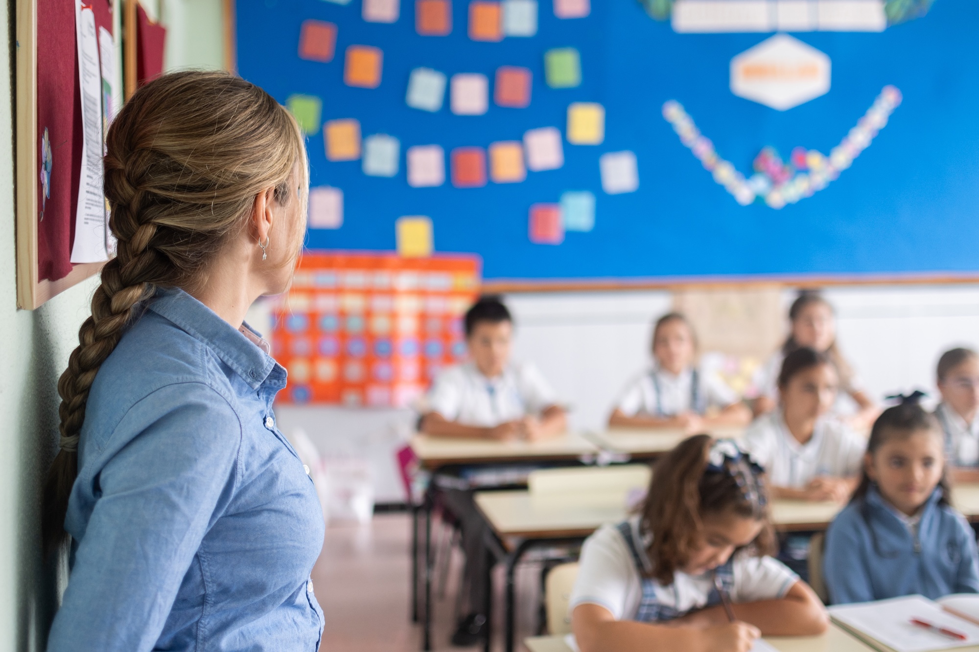 Teacher watching students